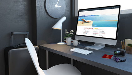 navy desktop with travel accesories and luxury resort website