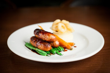 Sausage, mash and seasonal vegetables