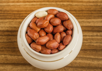 Peanuts red potted brown background