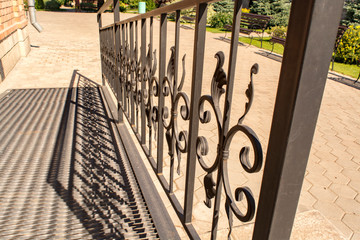 Metal handrails at the ramp for the disabled