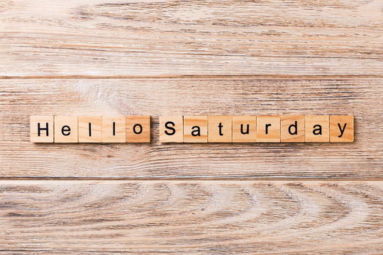 hello saturday word written on wood block. hello saturday text on wooden table for your desing, concept