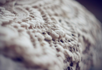 On the background of hanging delicate lace fabric white in which you can go to the celebration