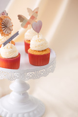 Tasty sweet pink cupcakes. Decorated dessert table