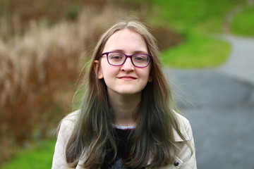 Portrait of young woman outdoors