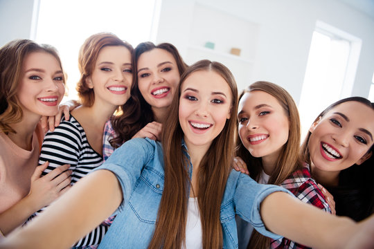 Self-portrait of nice cute lovely charming attractive cheerful cheery ladies spending free spare time in light white interior room indoors