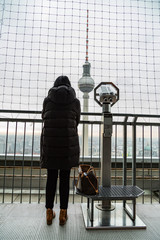 Woman near Fernsehturm Television Tower in Berlin, Germany