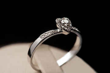 heart shaped wedding diamond ring on black background