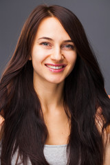 Happy Beautiful brunette woman in dress