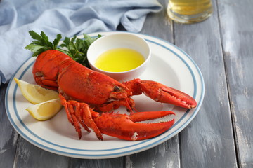 Lobster on plate with lemon and parsley