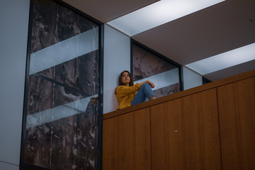 man looking through window