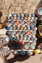 Traditional Moroccan market with souvenirs. Handmade ceramic plates