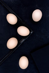Eggs on black background.
