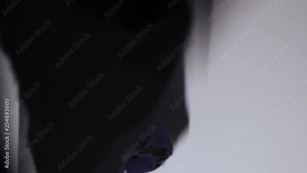 Poster close up shot of a shadowy figure opening a door with a set of keys and wearing gloves. concept of i