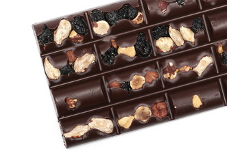 Chocolate bars with blueberries, hazelnuts and almonds isolated on white background