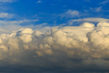 Clouds after rain before sunset as a background