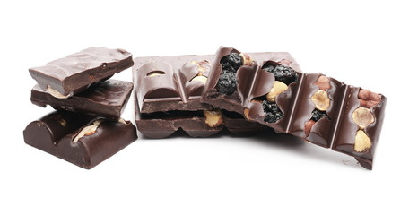Chocolate bars with blueberries, hazelnuts and almonds isolated on white background