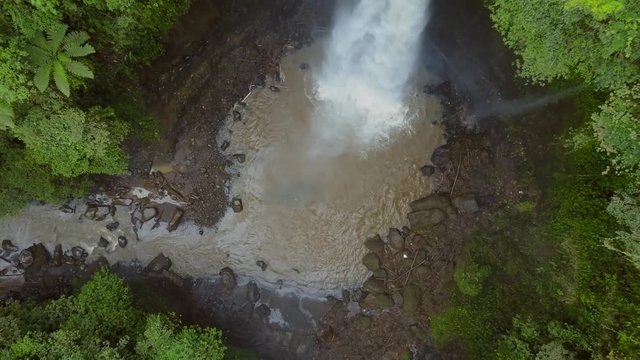 Nungnung waterfall in the middle of Bali, Indonesia. Aerial shots during an overcast day.