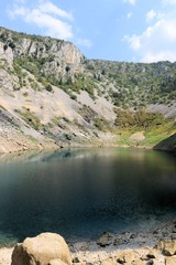 reflection on the Blue lake of Imotski, Croatia