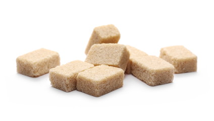 Brown cane sugar cubes isolated on white background
