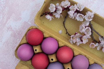 Obraz na płótnie Canvas Carton of colored Easter eggs