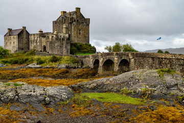 Fototapeta na wymiar Eilean Donan Castle at low tide, Loch Duich, Western Scotland, UK