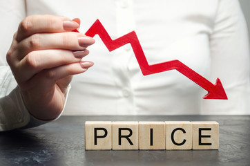 A woman holds a red arrow down over wooden blocks and the word Price. Concept of falling market...