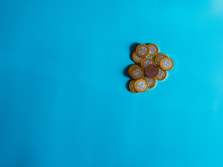 Chocolate coins on celestial background