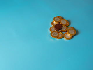 Chocolate coins on celestial background