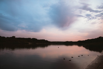 Obraz na płótnie Canvas pink sunset on the river