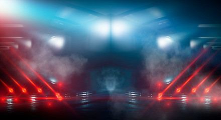 Background wall with neon lines and rays. Background of an empty dark corridor, parking, airport with neon light. Abstract background with lines and glow. Wet asphalt, the reflection of neon lights in