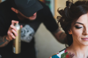 Young woman getting her hair done