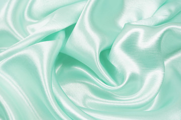 Smooth elegant blue silk or satin texture can use as abstract background