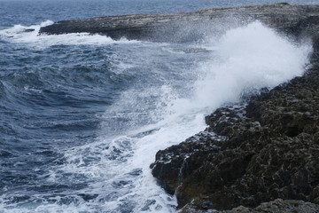 waves crashing on the rocks