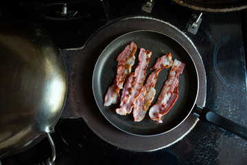 Frying bacon for breakfast