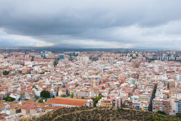 Fototapeta na wymiar Panoramic view for city Alicante in spain. Cityscape with cloudy sky.
