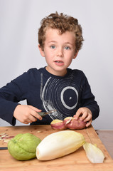 Fototapeta premium child peeling vegetables