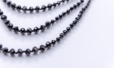 Closeup Black stone necklace  on white  background