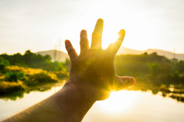 Use hand to touch the sun light in the morning, Pick up the sun by hand, Close the sun in your...