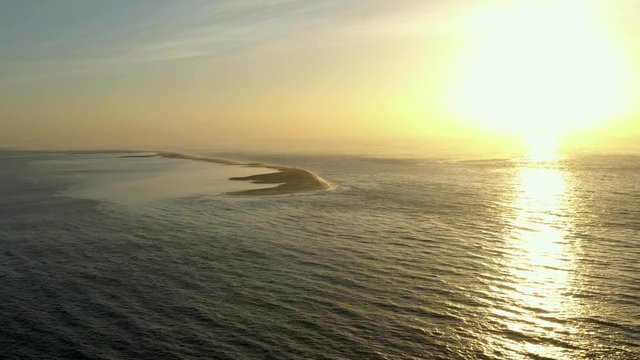 beautiful aerial view of the banc d'arguin which extends beside the sunset over the mighty atlantic ocean