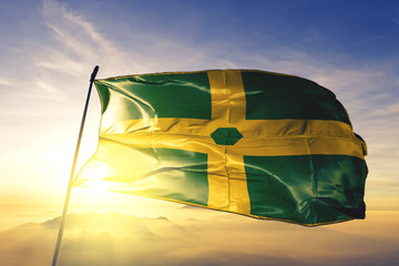 Patillas municipality of Puerto Rico flag waving on the top sunrise mist fog