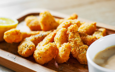 Fried Shrimp with sauce and lemon on wooden table background