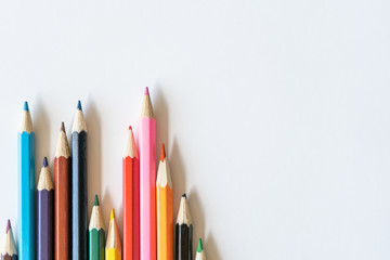 Color pencils for drawing on the left on white background