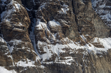 Fototapeta na wymiar Rocky Snow Covered Cliff Face