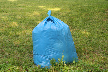 a garbage bag on grass