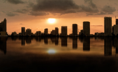 Obraz na płótnie Canvas vibrant city sunset reflections
