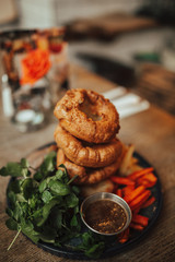 A close up shot of traditional British food, Sunday roast. Yorkshire pudding with roasted meat and vegetables. Concept of family lunch, celebration and traditional cuisine.