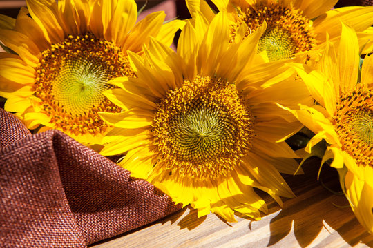 Beautiful yellow sunflower flowers bouquet on wooden background