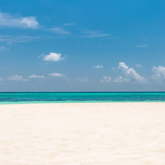Fototapeta premium Empty beach scene with white sand and blue sea view. Sea sand sky concept