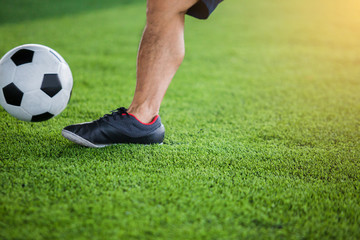 Obraz premium Soccer player speed run to control and shoot ball to goal on artificial turf.