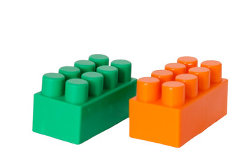 Fototapeta premium details of a children's plastic constructor on a white background. colored cubes. block.